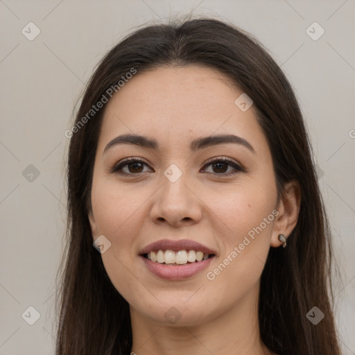 Joyful white young-adult female with long  brown hair and brown eyes