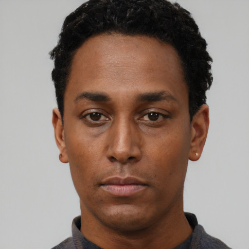 Neutral black young-adult male with short  black hair and brown eyes