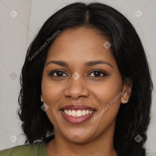 Joyful black young-adult female with long  brown hair and brown eyes