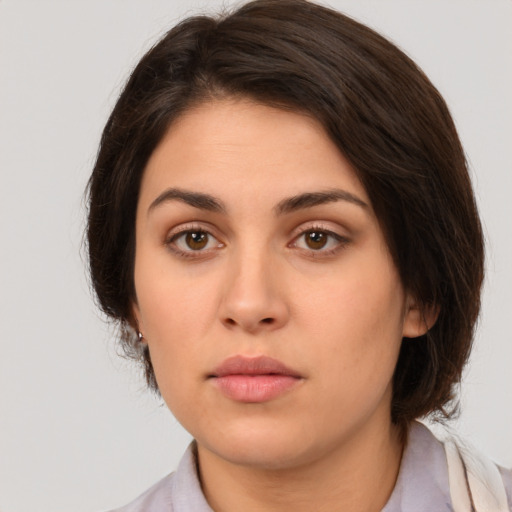 Neutral white young-adult female with medium  brown hair and brown eyes
