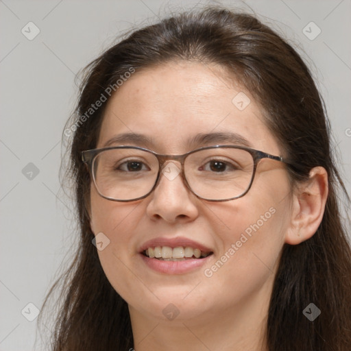 Joyful white adult female with long  brown hair and brown eyes