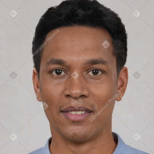 Joyful latino adult male with short  black hair and brown eyes