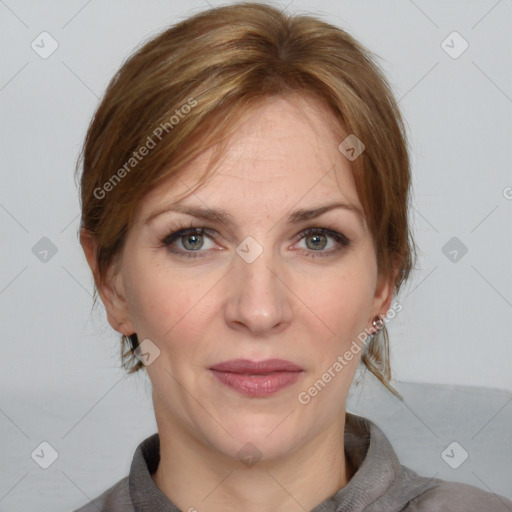 Joyful white adult female with medium  brown hair and grey eyes