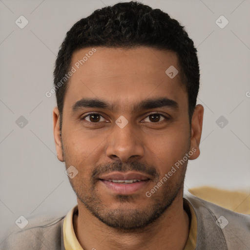 Joyful latino young-adult male with short  black hair and brown eyes