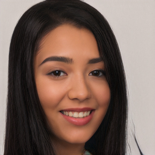 Joyful latino young-adult female with long  black hair and brown eyes