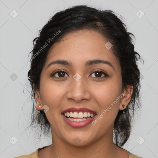 Joyful latino young-adult female with medium  brown hair and brown eyes