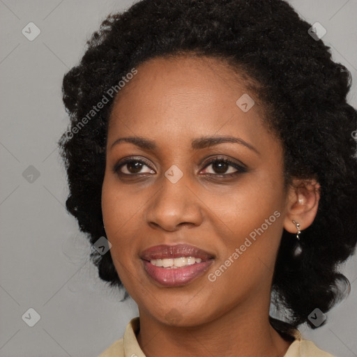 Joyful black young-adult female with long  black hair and brown eyes