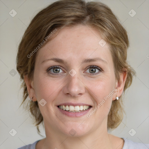 Joyful white young-adult female with medium  brown hair and blue eyes