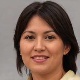 Joyful white adult female with medium  brown hair and brown eyes