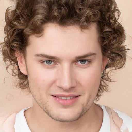 Joyful white young-adult male with medium  brown hair and brown eyes