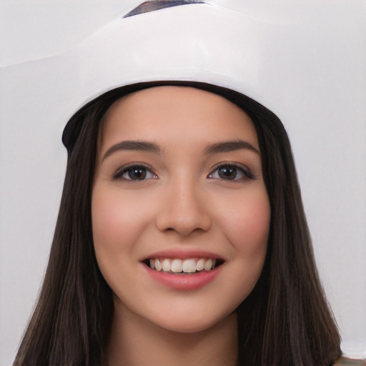 Joyful white young-adult female with long  black hair and brown eyes