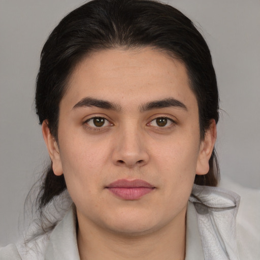 Neutral latino young-adult male with medium  brown hair and brown eyes