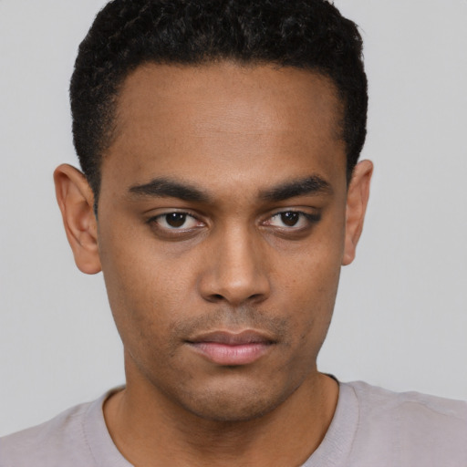 Neutral black young-adult male with short  brown hair and brown eyes