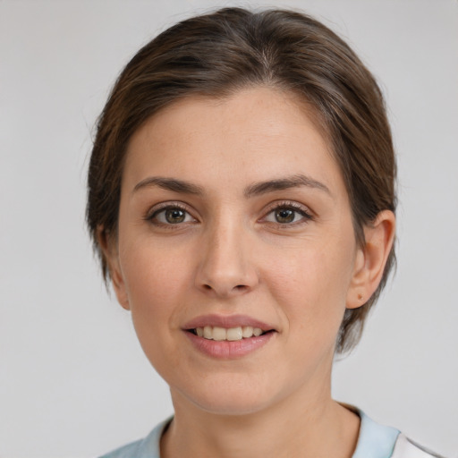 Joyful white young-adult female with medium  brown hair and brown eyes