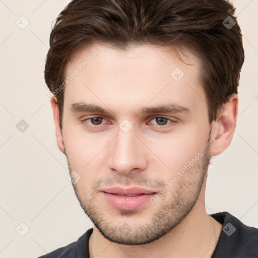 Neutral white young-adult male with short  brown hair and brown eyes