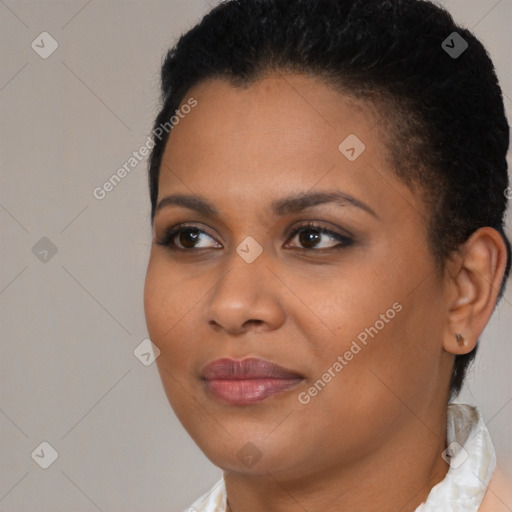 Joyful black young-adult female with short  brown hair and brown eyes