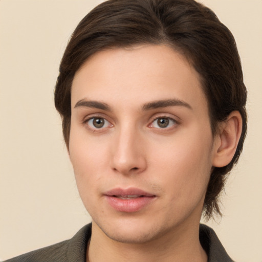 Neutral white young-adult female with short  brown hair and brown eyes