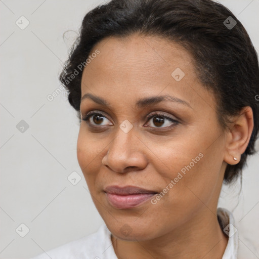 Joyful latino young-adult female with short  brown hair and brown eyes