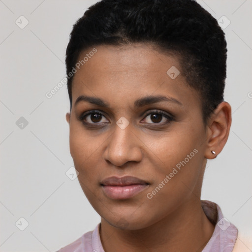 Joyful black young-adult female with short  black hair and brown eyes