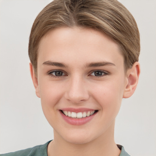 Joyful white young-adult female with short  brown hair and brown eyes