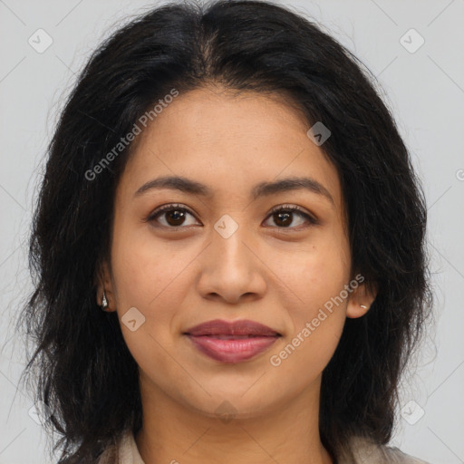 Joyful latino young-adult female with long  brown hair and brown eyes