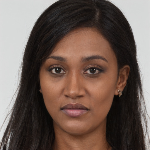 Joyful asian young-adult female with long  brown hair and brown eyes