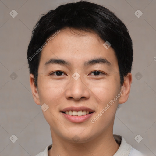 Joyful asian young-adult male with short  black hair and brown eyes