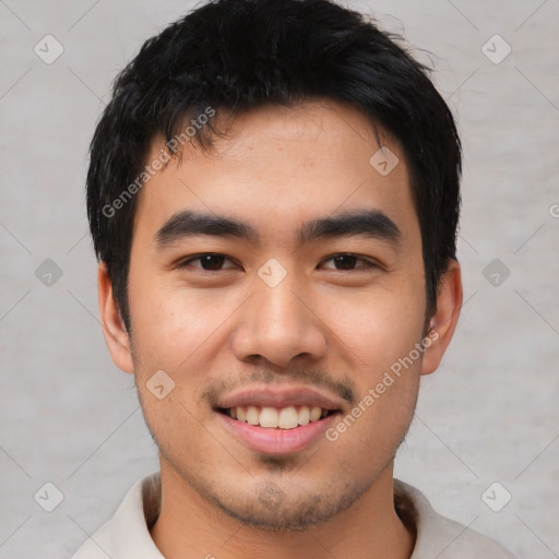 Joyful asian young-adult male with short  black hair and brown eyes