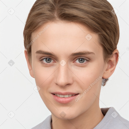 Joyful white young-adult female with short  brown hair and grey eyes