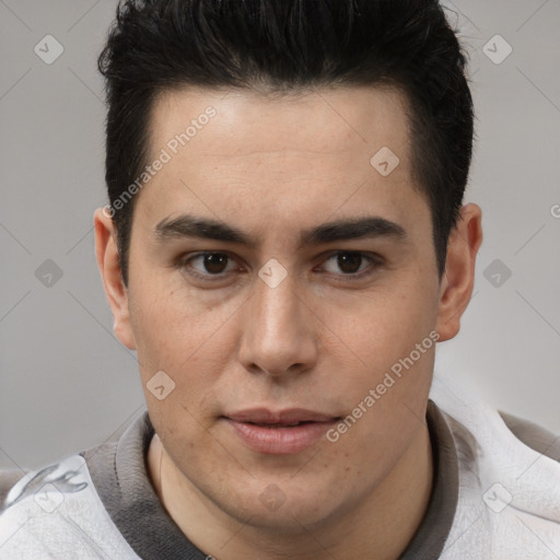 Joyful latino young-adult male with short  brown hair and brown eyes