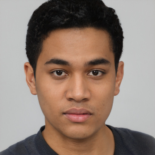 Neutral latino young-adult male with short  black hair and brown eyes
