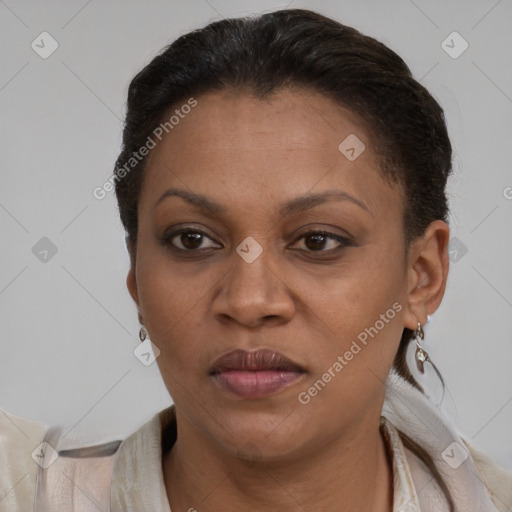 Joyful latino adult female with short  brown hair and brown eyes