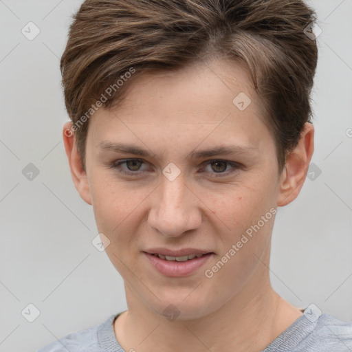 Joyful white young-adult female with short  brown hair and grey eyes