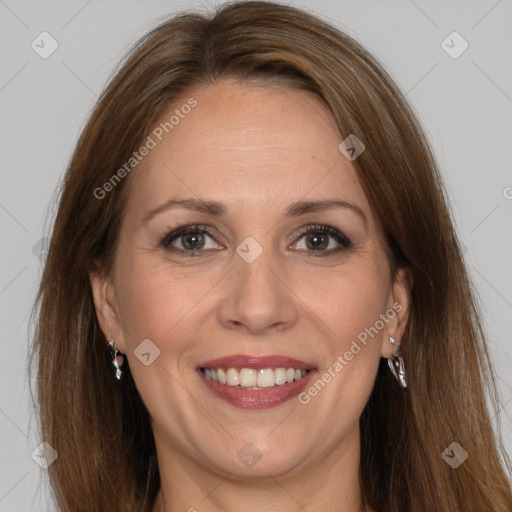 Joyful white adult female with long  brown hair and brown eyes