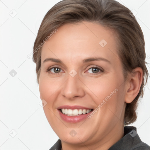 Joyful white adult female with medium  brown hair and grey eyes