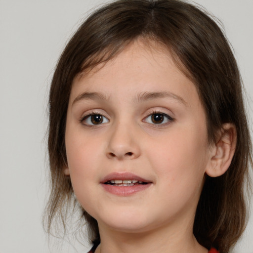 Joyful white child female with medium  brown hair and brown eyes