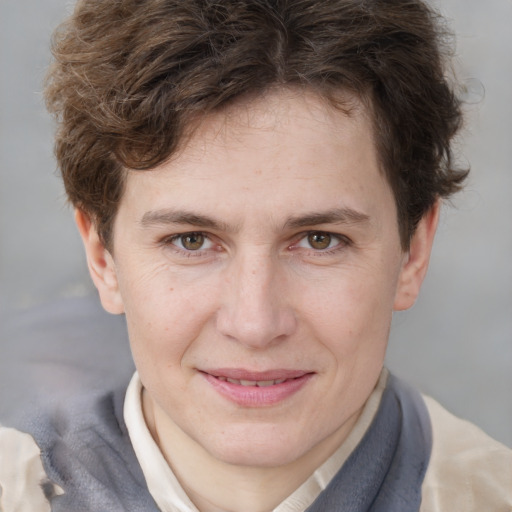 Joyful white young-adult male with short  brown hair and blue eyes