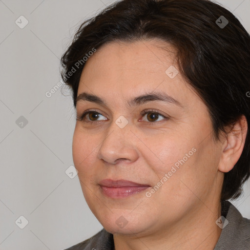 Joyful white adult female with medium  brown hair and brown eyes