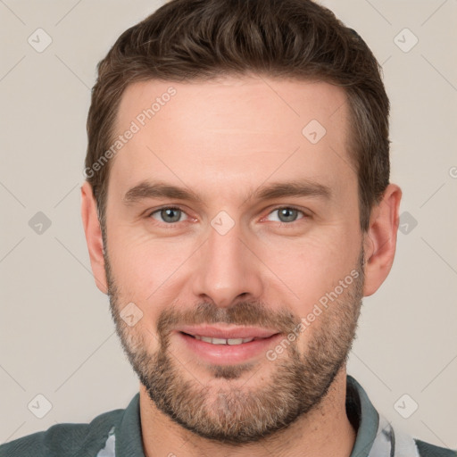 Joyful white young-adult male with short  brown hair and grey eyes