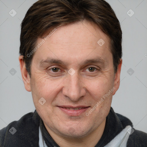 Joyful white adult male with short  brown hair and brown eyes