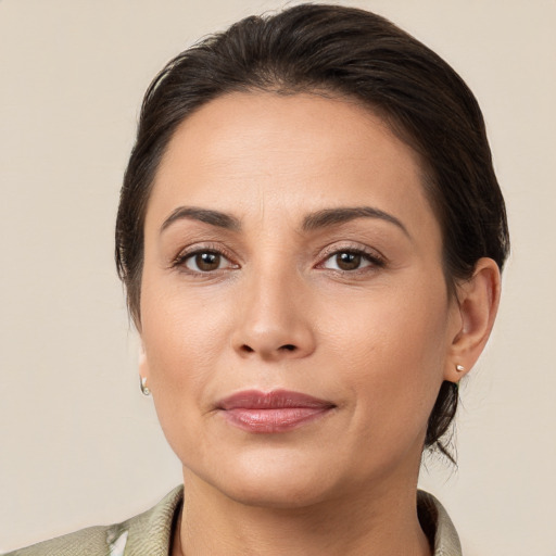 Joyful white young-adult female with medium  brown hair and brown eyes