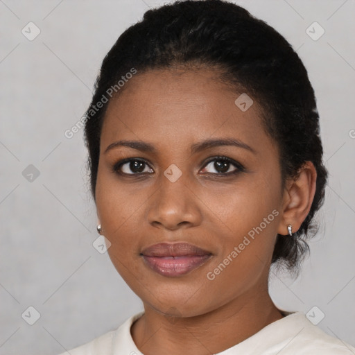 Joyful black young-adult female with medium  black hair and brown eyes