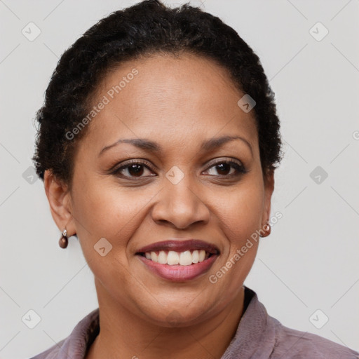 Joyful black adult female with short  brown hair and brown eyes