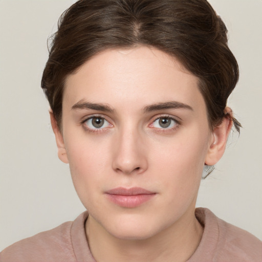 Neutral white young-adult female with short  brown hair and brown eyes