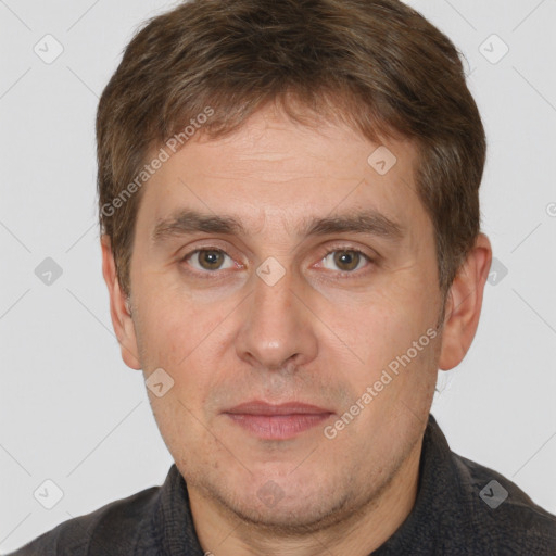 Joyful white adult male with short  brown hair and brown eyes