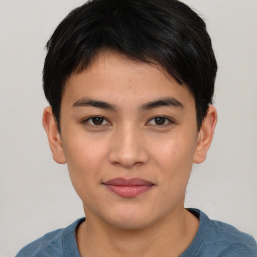 Joyful asian young-adult male with short  brown hair and brown eyes
