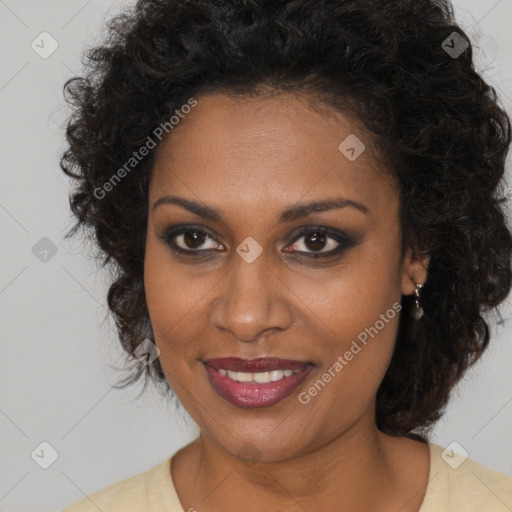 Joyful black young-adult female with medium  brown hair and brown eyes