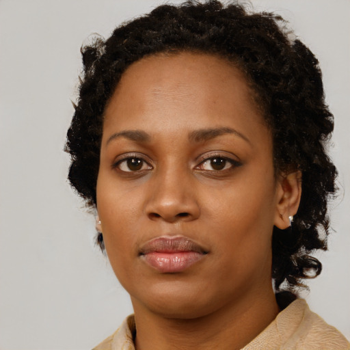Neutral black young-adult female with short  brown hair and brown eyes