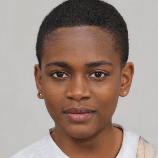 Joyful black child female with short  black hair and brown eyes