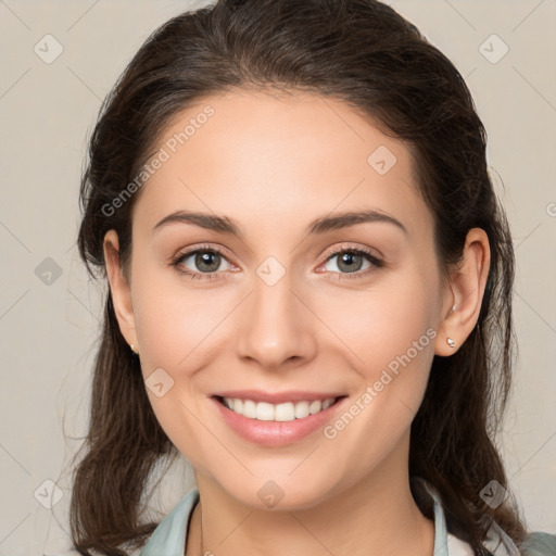 Joyful white young-adult female with medium  brown hair and brown eyes